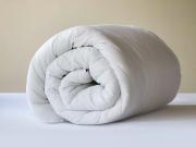 10.5 Tog white, soft hollowfiber duvet rolled up