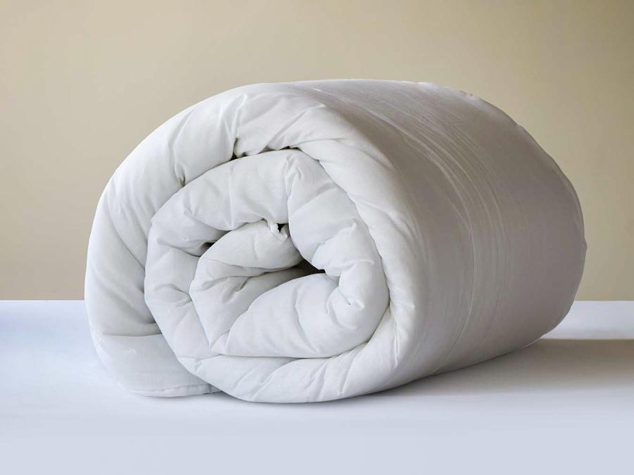 10.5 Tog white, soft hollowfiber duvet rolled up