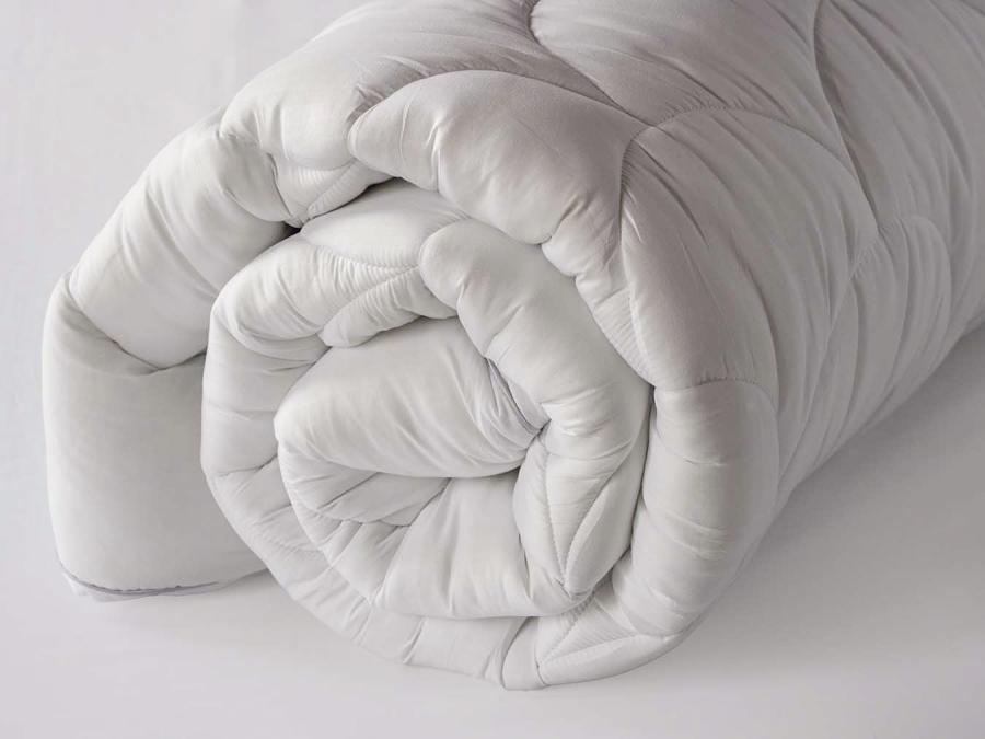 thick white 5cm mattress protector rolled up