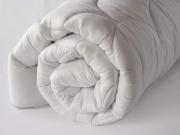 thick white 5cm mattress protector rolled up