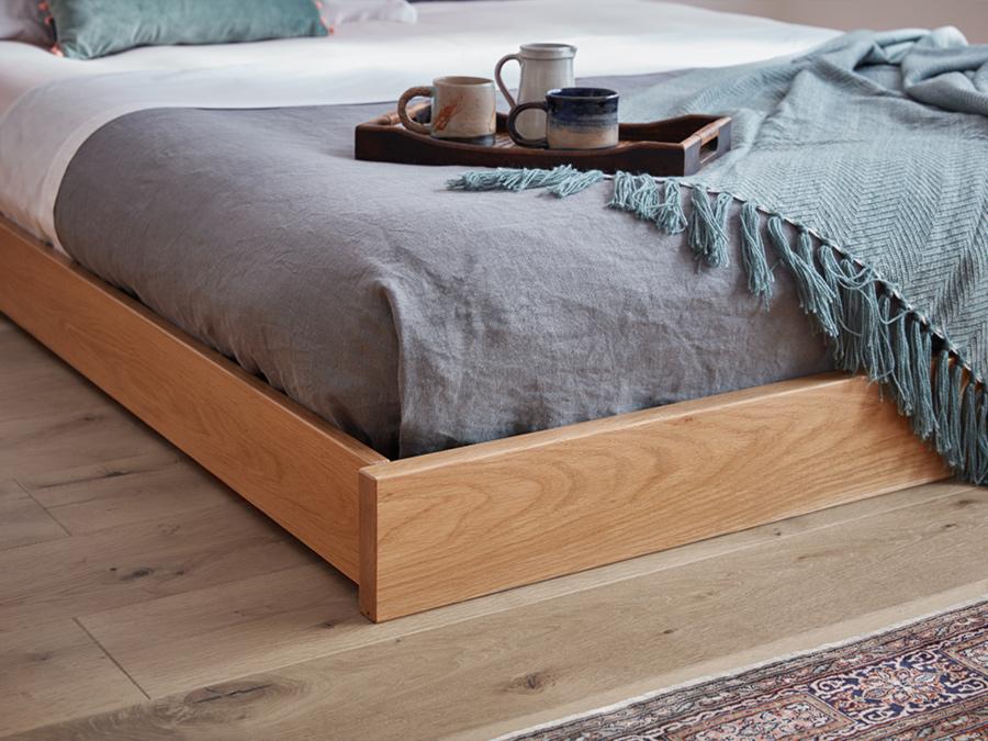 low platform bed enkel design footboard close up