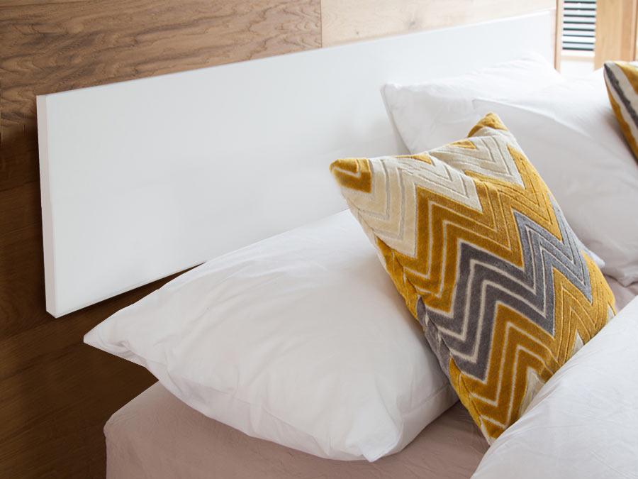 white wall mounted white headboard
