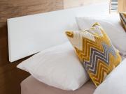 white wall mounted white headboard
