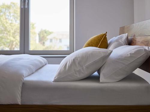 Soft bedding on wooden bed