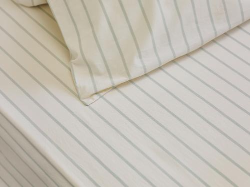 Mellow Green Slumber Stripe Cotton Fitted Sheet Styled Bedroom Setting