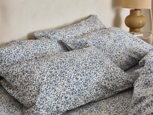 Mini Meadow Blue Cotton Pillowcases Styled Bedroom Setting