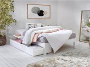 Platform bed in white with deluxe rug