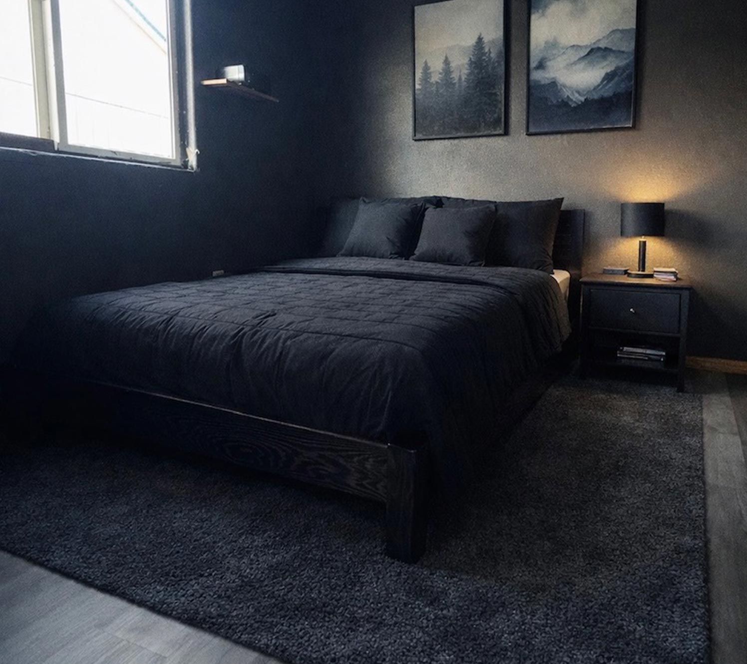 Black bed in a black and gold bedroom